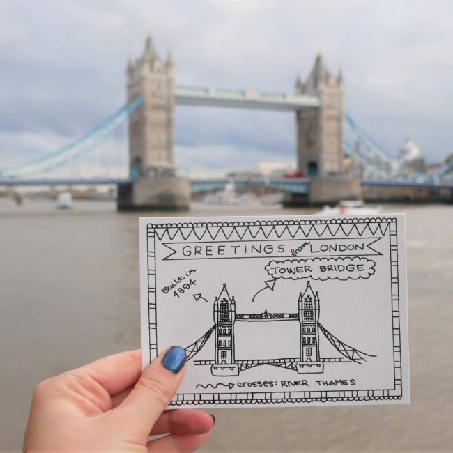 Holding postcard from London